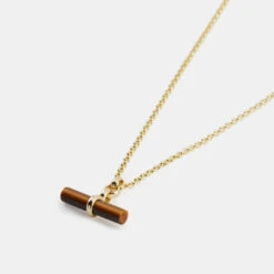 Gold Tigers Eye T-Bar Necklace 10 Gold Tigers Eye T-Bar Necklace -SERGE DENIMES Shop Gold Tigers Eye T Bar Necklace Product Shot Grey